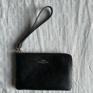 Black coach wristlet with gold accents